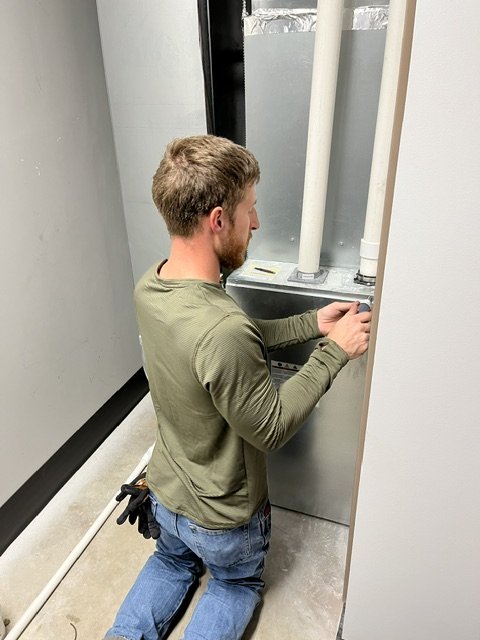 Technician performing a preventative maintenance inspection